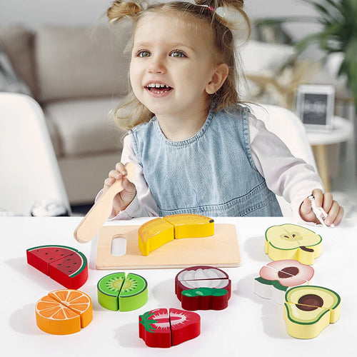 child playing with Montessori Fruit Cutting Set